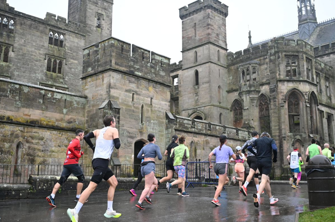 Runners adventuring through Alton Towers park and resort