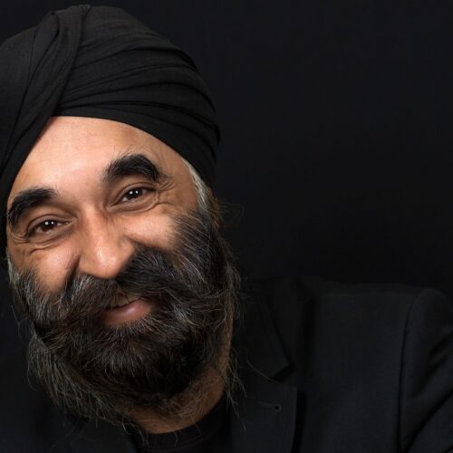 A man's face against a black background