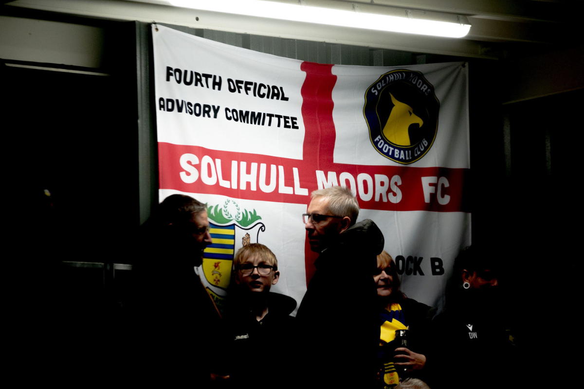 Solihull Moors An England flag hung up with the Solihull Moors logo and name written on it.