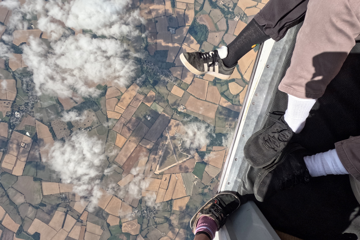 Acorns skydive A view of the earth high up in a plane.