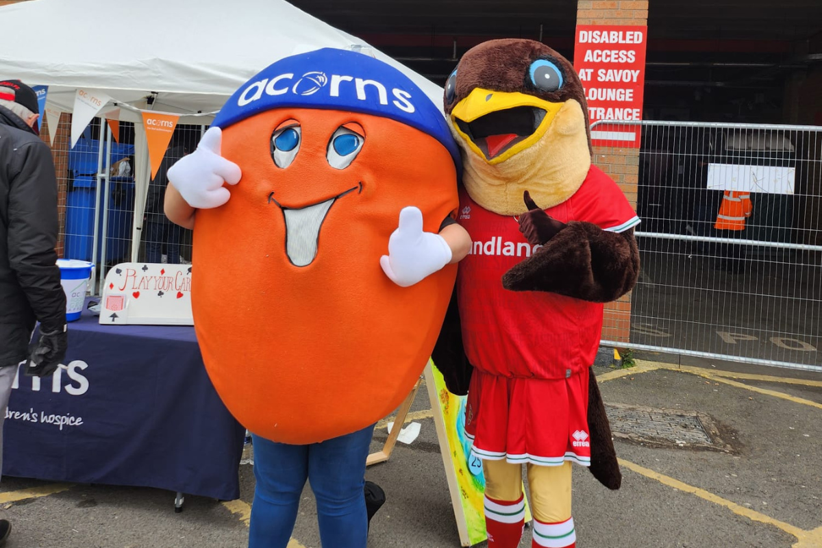Alex the Acorns and Swifty the Eagle mascots stood together.