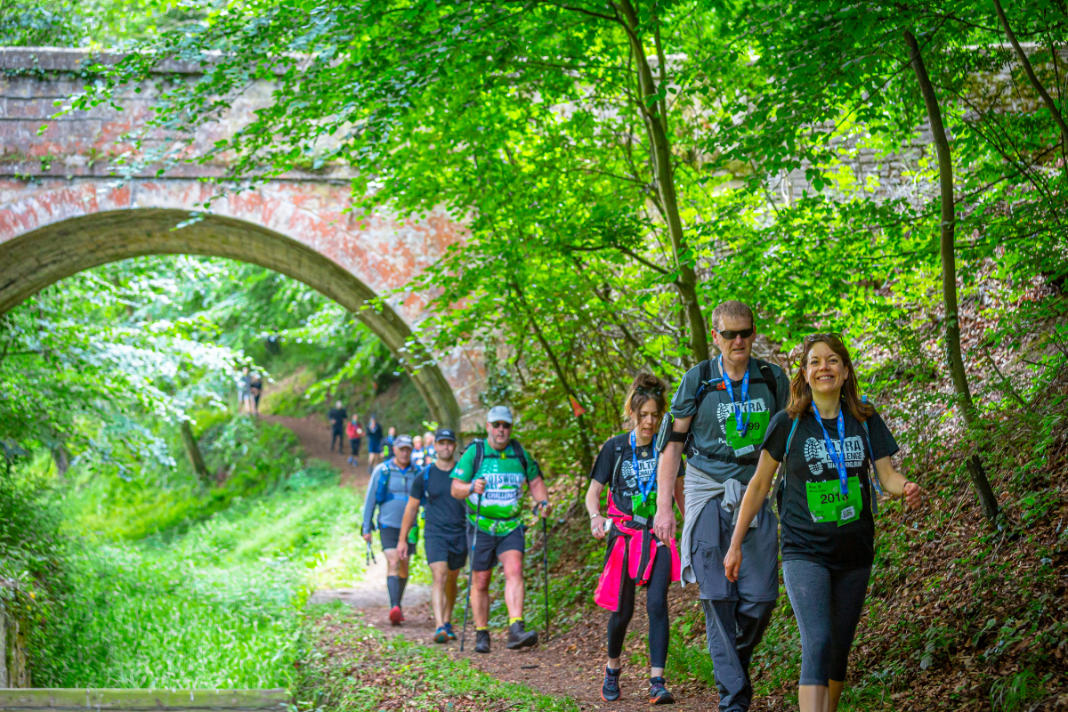 A row of people walking as part of the Cotswold Way Ultra Challenge.