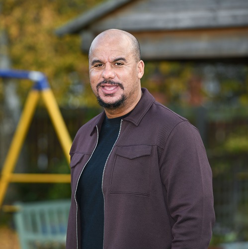 A man standing in Acorns hospice gardens