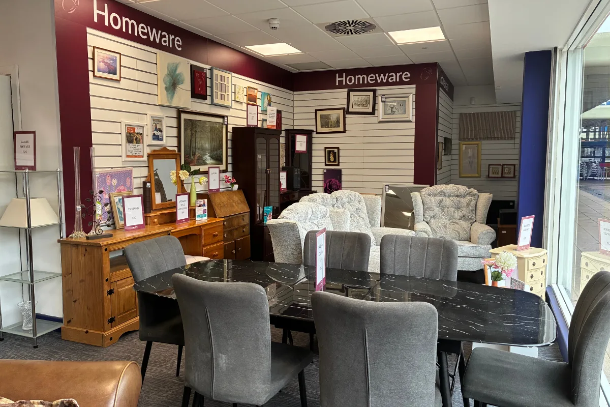 Quality donated furniture displayed in an Acorns charity shop.