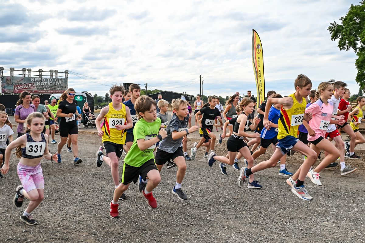 A large group of children running in the Worcester Pitchcroft fun run,