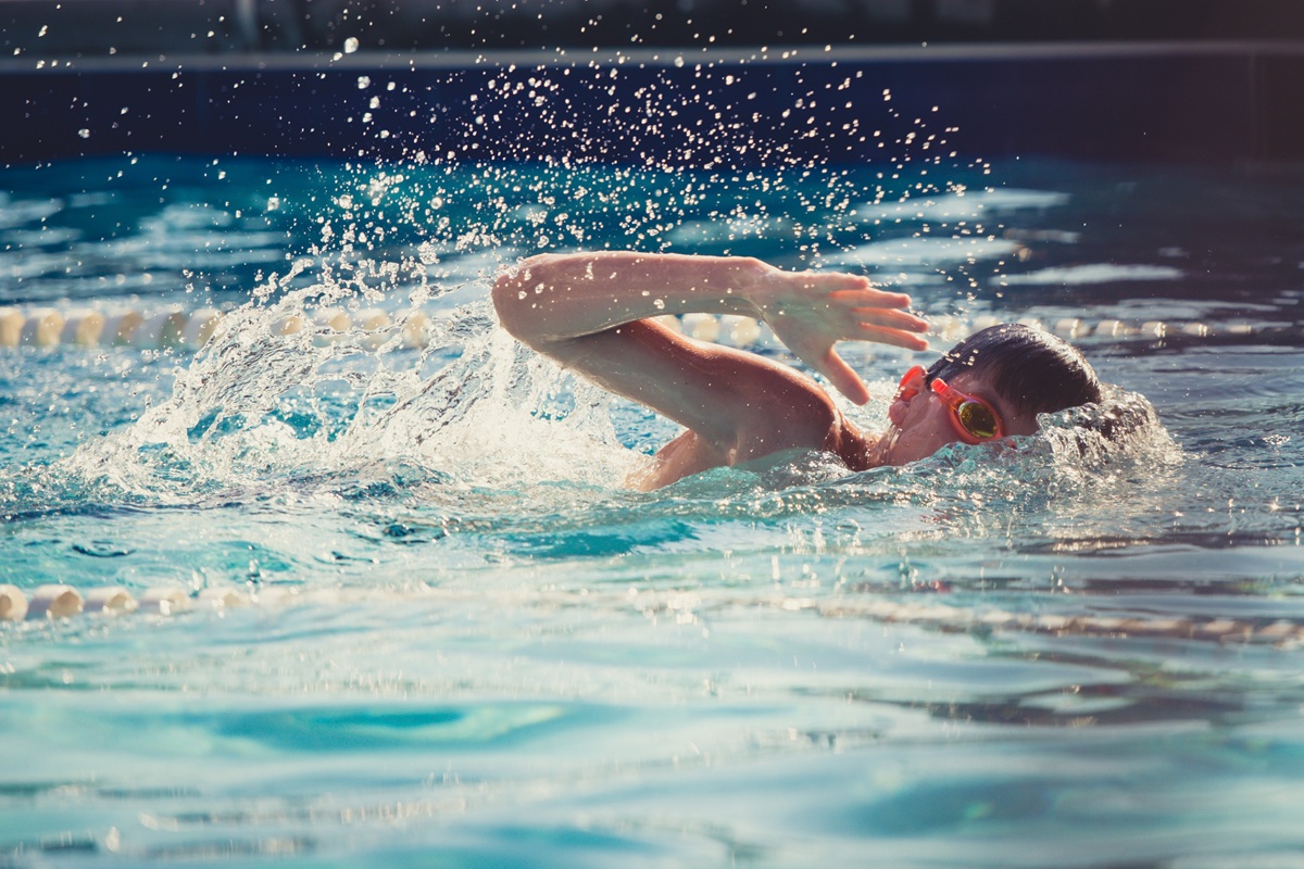 front crawl swimmer A swimmer doing front crawl in a pool