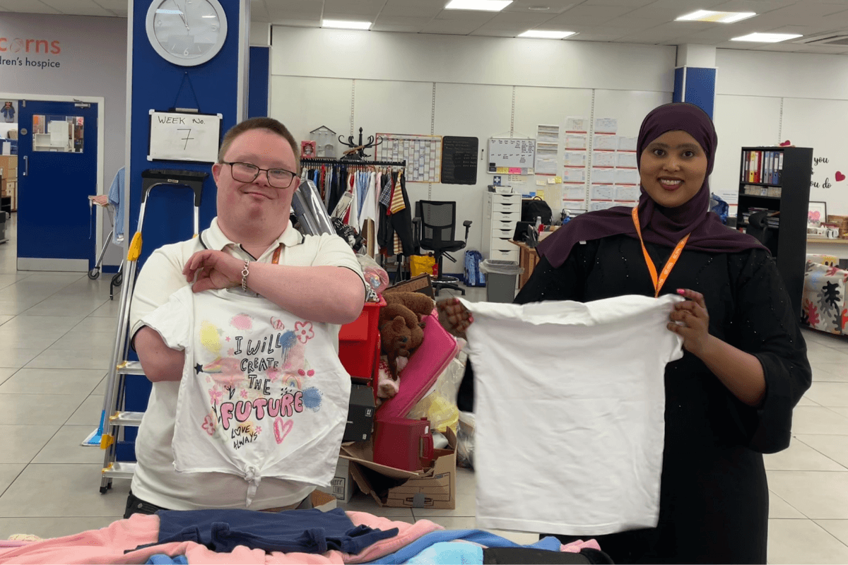 Acorns retail volunteers working together in one of the charity's shops.