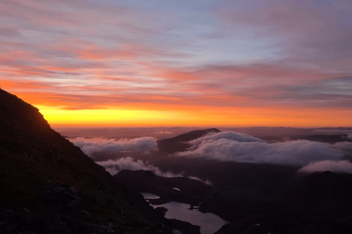 Sunrise trek An orange sunrise from the top of Snowdon.