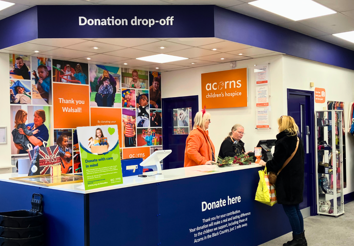 A shopper donates good quality items to Acorns Children's Hospice.