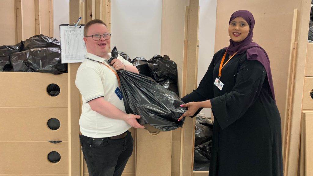 Sorting through generously donated stock items at Acorns Children's Hospice superstore in Walsall.